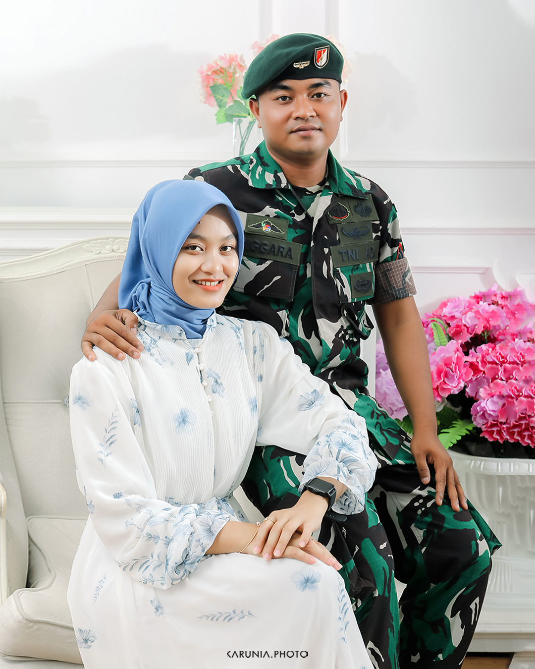 Bride and groom-to-be holding hands and walking along city streets with romantic bokeh lights